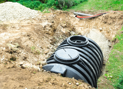 septic tank half buried in ground